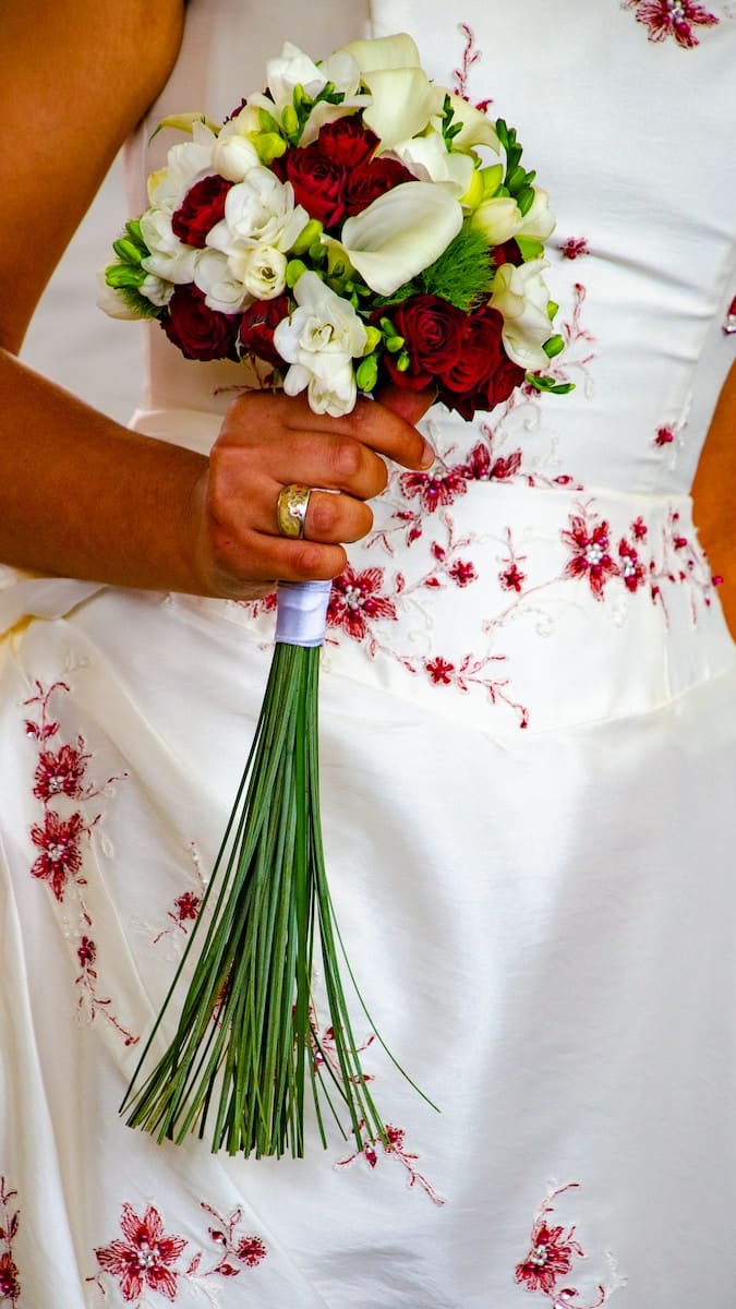 a person holding a bouquet of flowers